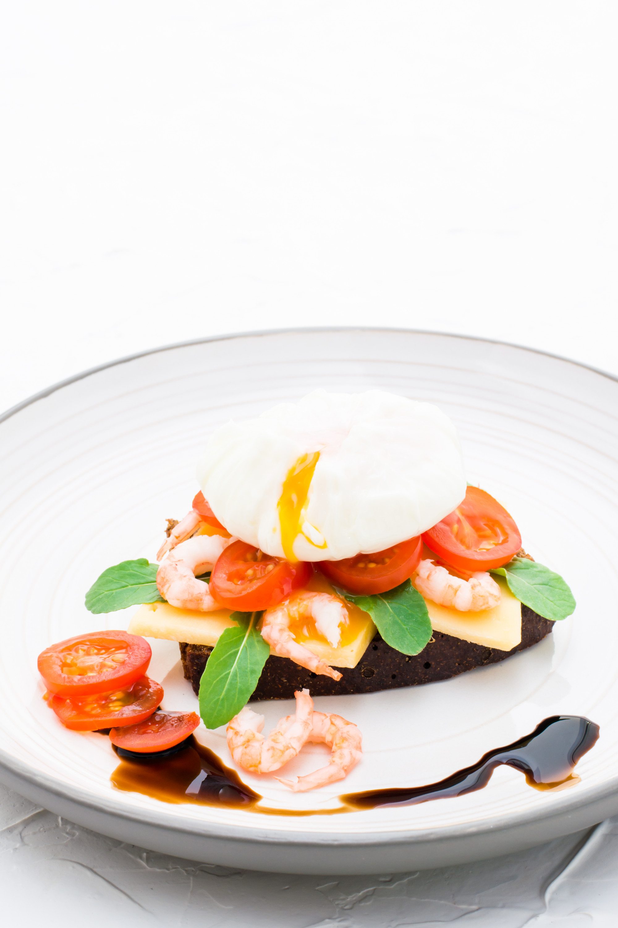 Large plated dish photographed in studio lighting
